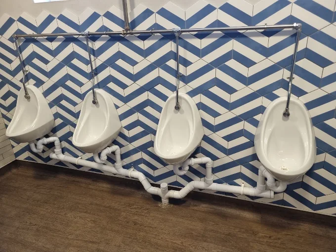 Commercial urinal installation with new pipework
